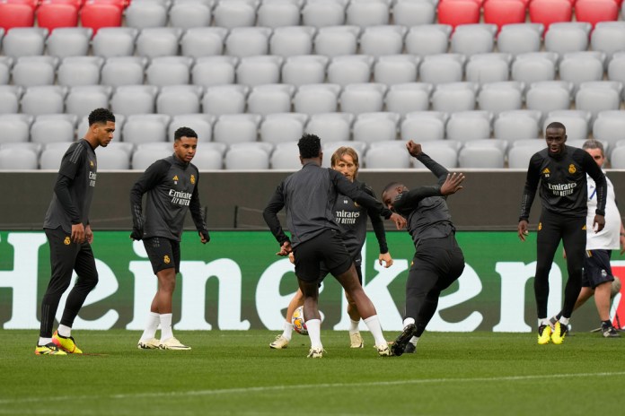 From left, Jude Bellingham, Rodrygo, Vinicius Junior, Luka Modric, Antonio Rudiger and Ferland Mendy of Real Madrid attend a training session in Munich (AP Photo/Matthias Schrader)