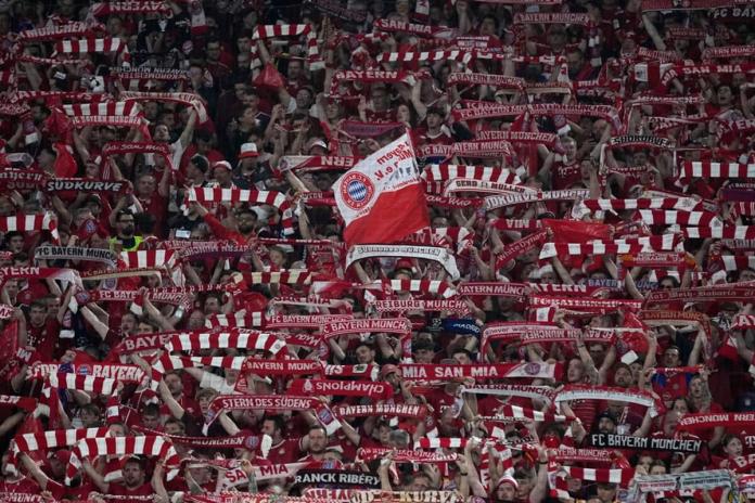 Bayern Munich fans cheer ahead of the Champions League semifinal first leg soccer match between Bayern Munich and Real Madrid at the Allianz Arena in Munich, Germany, Tuesday, April 30, 2024. (AP Photo/Matthias Schrader)