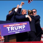 El expresidente Donald Trump es rodeado por agentes del Servicio Secreto de Estados Unidos en un acto de campaña, el sábado 13 de julio de 2024, en Butler, Pensilvania. (AP Foto/Evan Vucci)