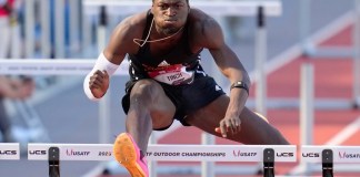 ARCHIVO - Cordell Tinch compite en la primera ronda de los 400 metros con vallas masculinos durante el campeonato de atletismo de Estados Unidos en Eugene, Oregon, el sábado 8 de julio de 2023. (Foto AP/Ashley Landis, archivo)