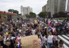 Manifestantes marchan contra los resultados oficiales de las elecciones que declaran ganador al presidente Nicolás Maduro, el día después de los comicios en Caracas, Venezuela, el lunes 29 de julio de 2024. (AP Foto/Matías Delacroix)