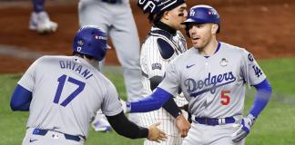 New York (United States), 28/10/2024.- Dodgers Freddie Freeman (R) celebrates hitting a two run home run with teammate Shohei Ohtani (L) during the first inning of game three of the Major League Baseball (MLB) World Series between the American League Champion New York Yankees and the National League Champion Los Angeles Dodgers at Yankees Stadium in the Bronx borough of New York, New York, USA, 28 October 2024. The World Series is the best-of-seven games. (Nueva York) EFE/EPA/CJ GUNTHER