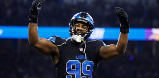 Detroit Lions defensive end Za'Darius Smith (99) celebrates after he sacked Minnesota Vikings quarterback Sam Darnold during the first half of an NFL football game Sunday, Jan. 5, 2025, in Detroit. (AP Photo/Rey Del Rio)