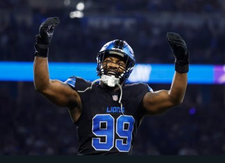 Detroit Lions defensive end Za'Darius Smith (99) celebrates after he sacked Minnesota Vikings quarterback Sam Darnold during the first half of an NFL football game Sunday, Jan. 5, 2025, in Detroit. (AP Photo/Rey Del Rio)