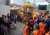 Personas del albergue ubicado en Escuintla regresando a sus comunidades. Foto La Hora: CONRED