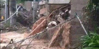 Automovilistas reportan que colapso de muro de contención complican paso hacia Muxbal tras intensas lluvias