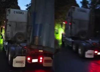 Tráiler averiado en el km 34 de la ruta a Santa Elena Barillas. Foto La Hora: Captura de pantalla